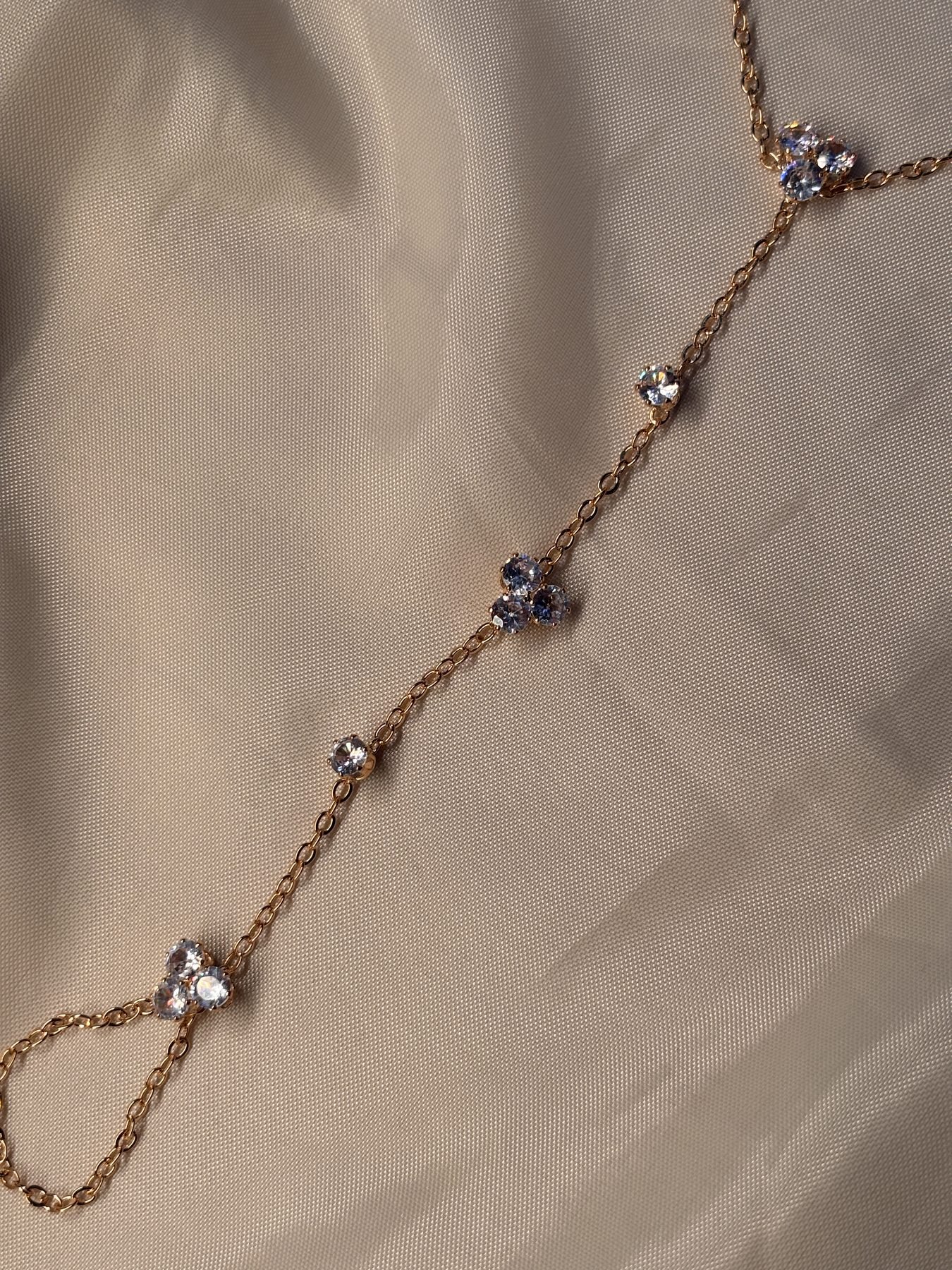 The Blossom Hand Chain showing the adjustable chain and finger loop