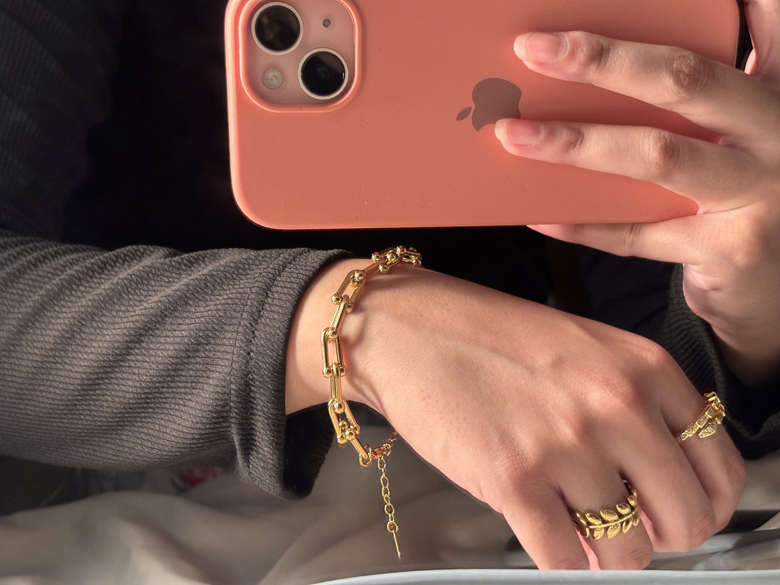 The Chunky Bracelet worn with a hand chain layered underneath