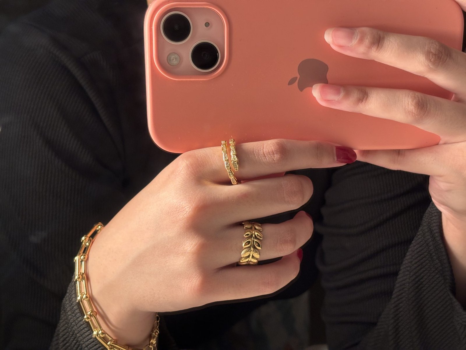 Chunky Combo worn: gold U-link bracelet with a leaf ring and wrap ring