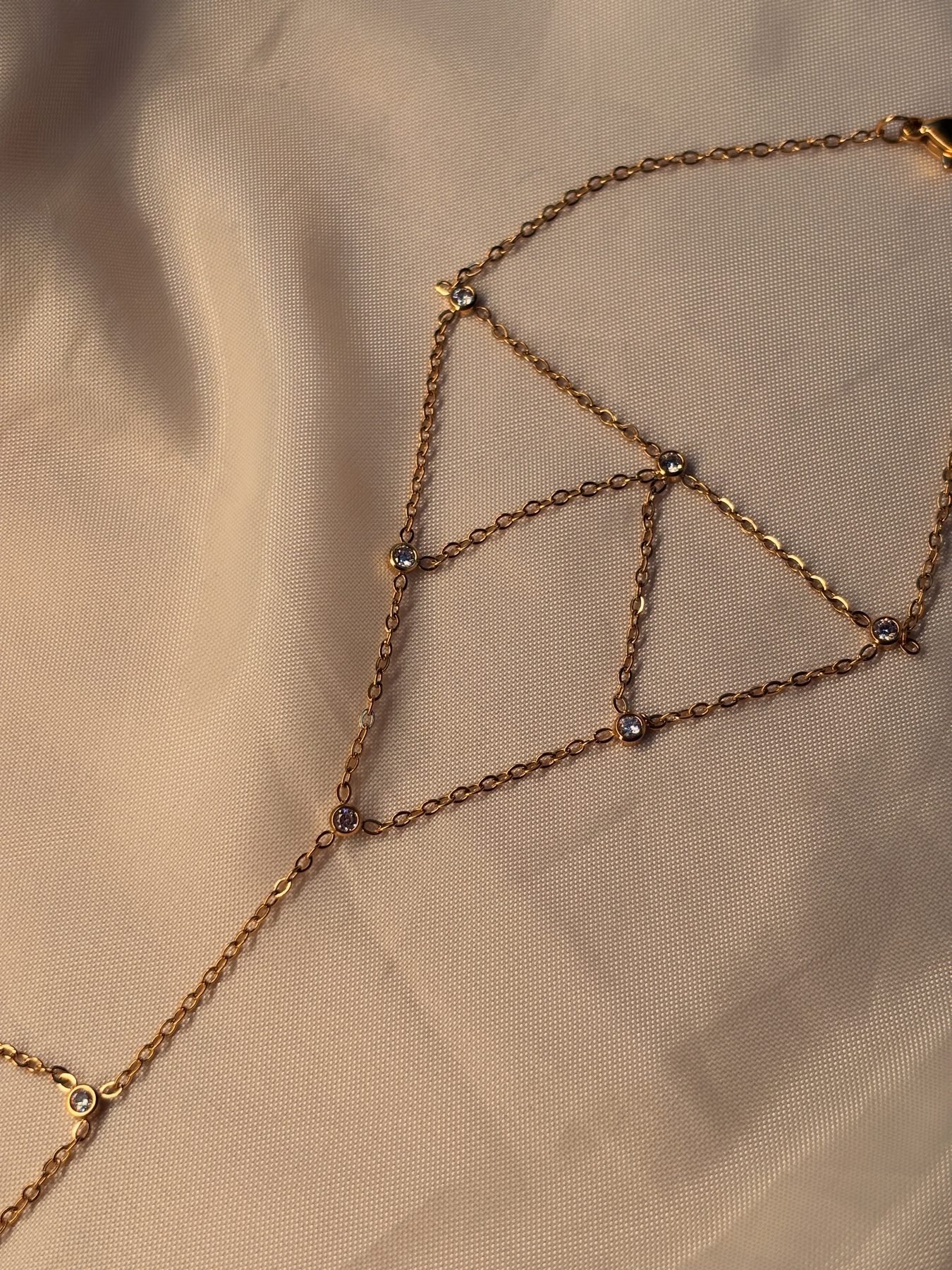 Detail of the lattice pattern and stone accents on the Glossy Hand Chain