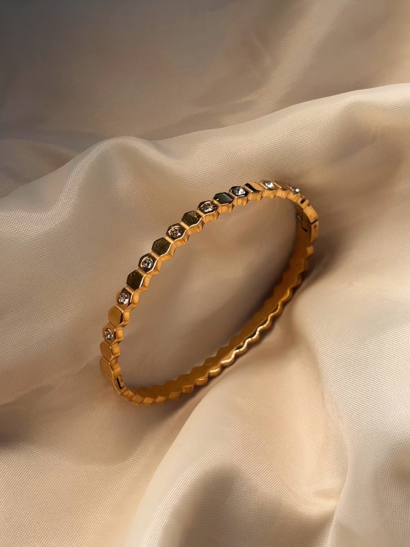 The Golden Hour Bangle on cream silk