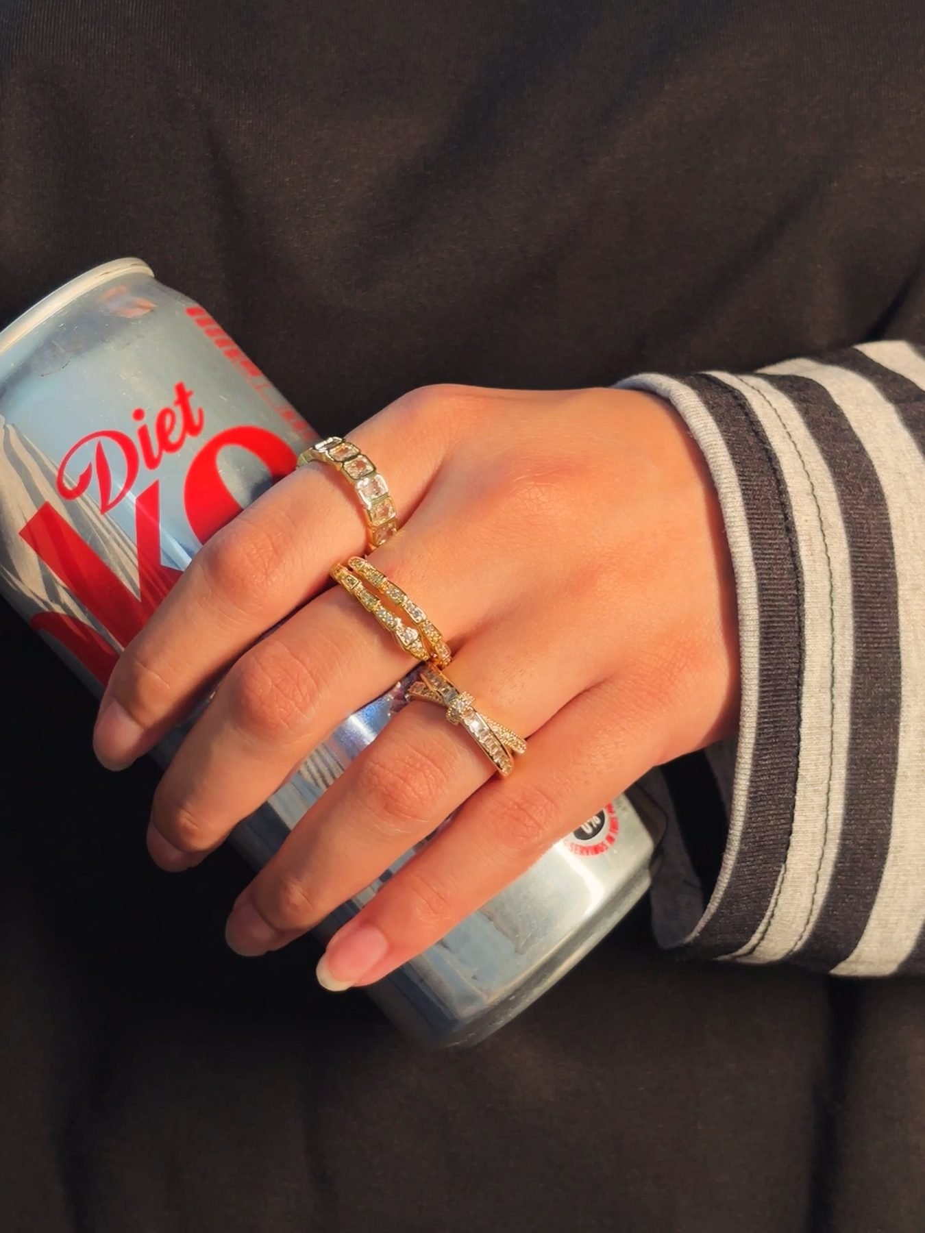Three stacking gold rings worn together