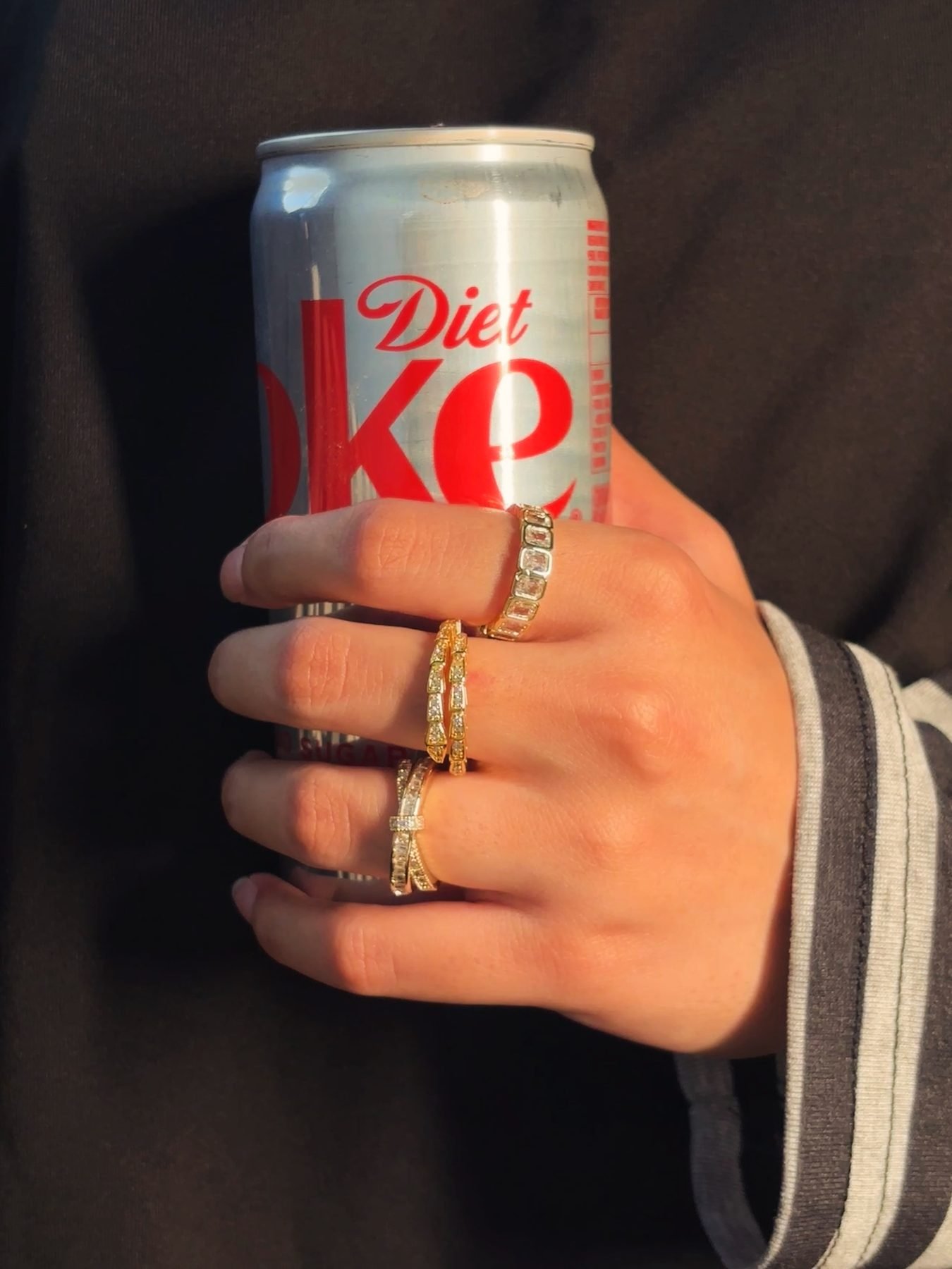 The three rings of the Aurabury Ring Stack worn together across two fingers
