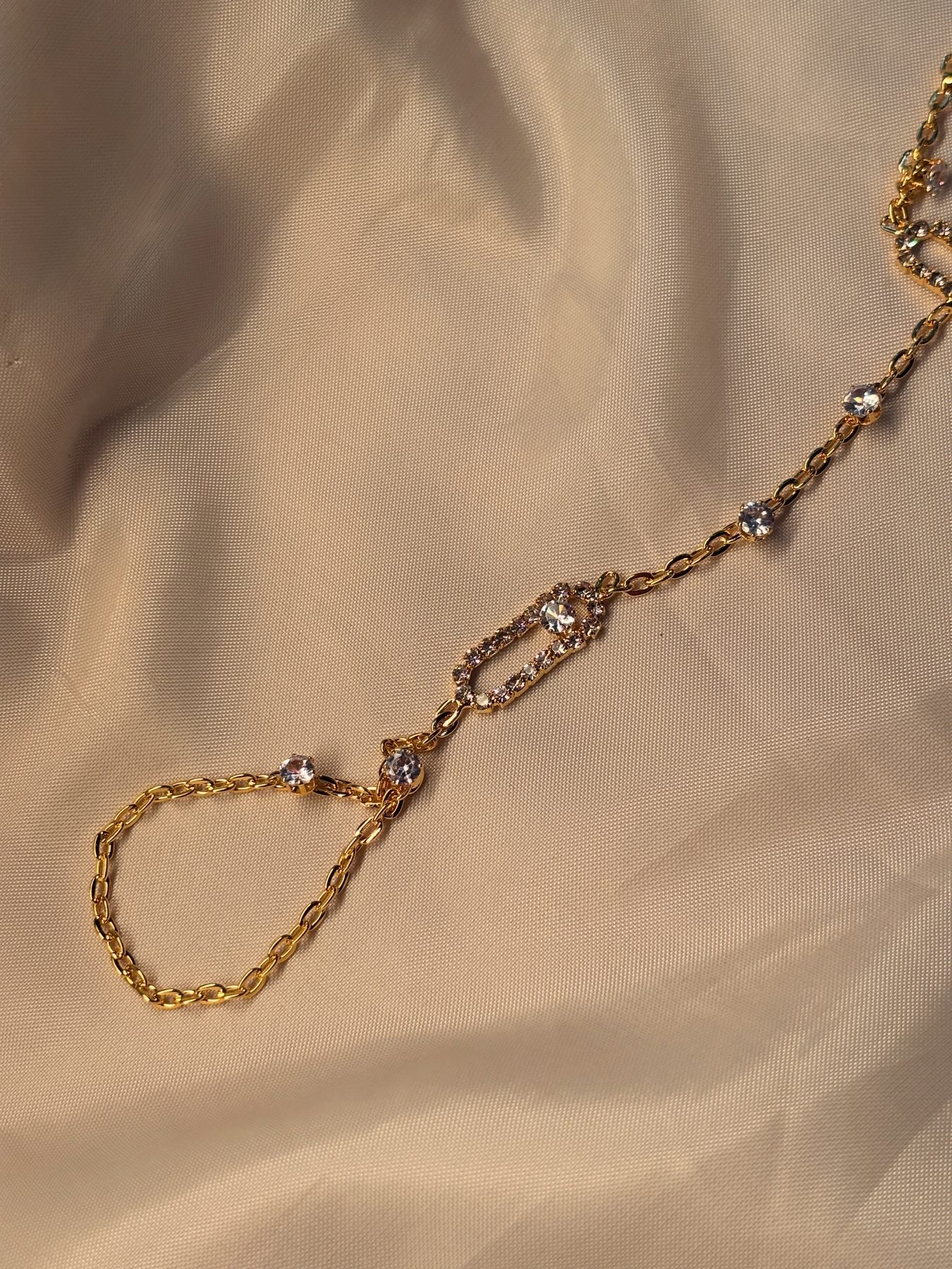 The finger loop and stone detail of The Statement Hand Chain